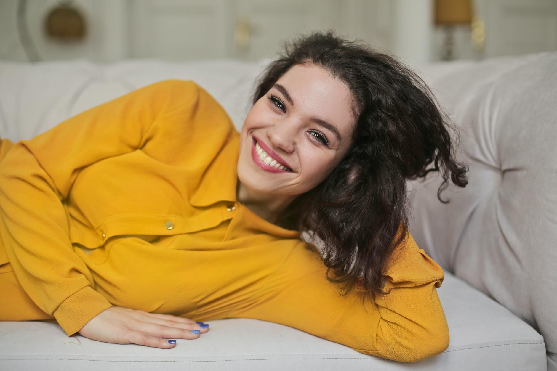 woman in yellow button up top