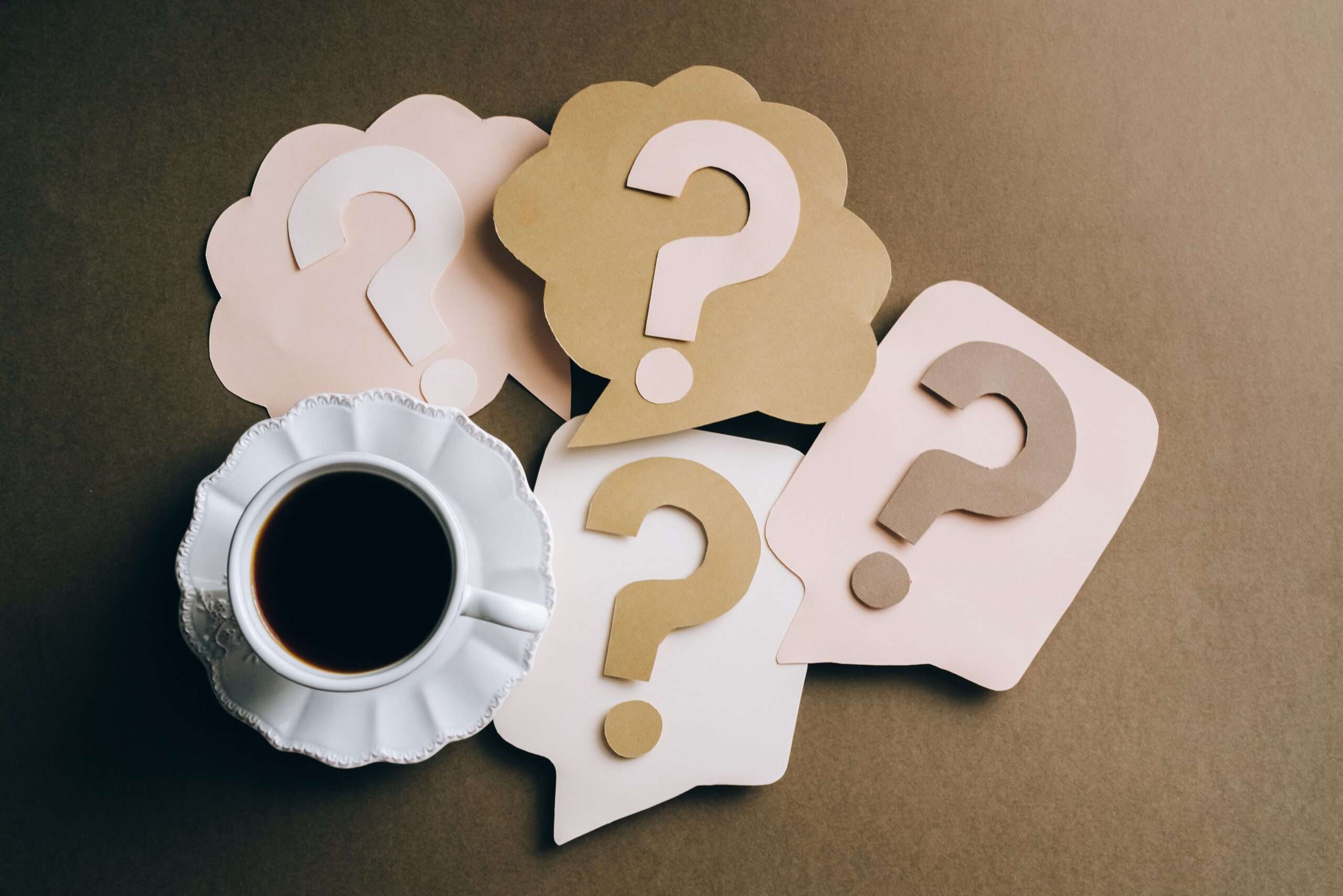 Questions Marks and a cup of coffee