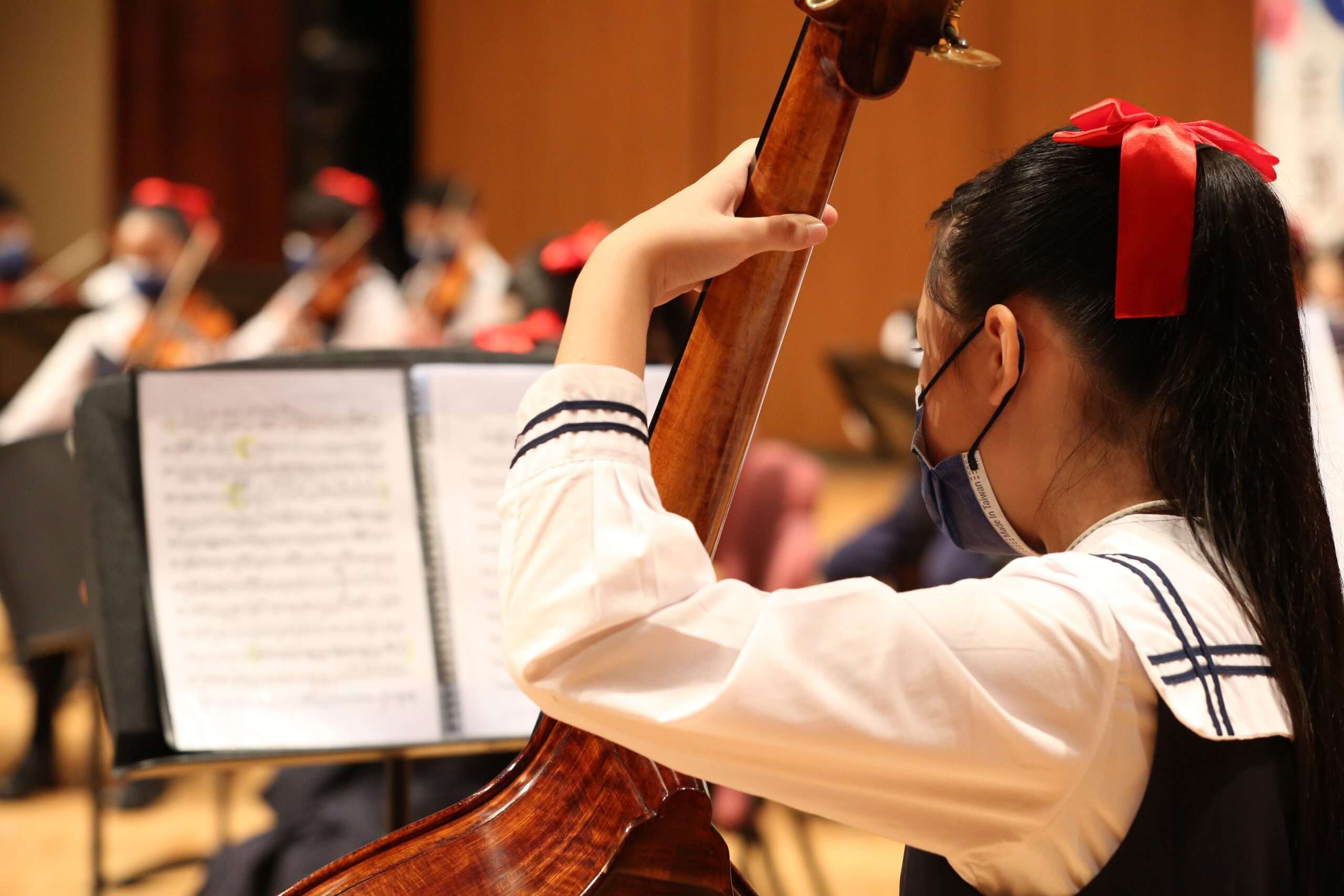 Middle school challenges young girl playing the cello