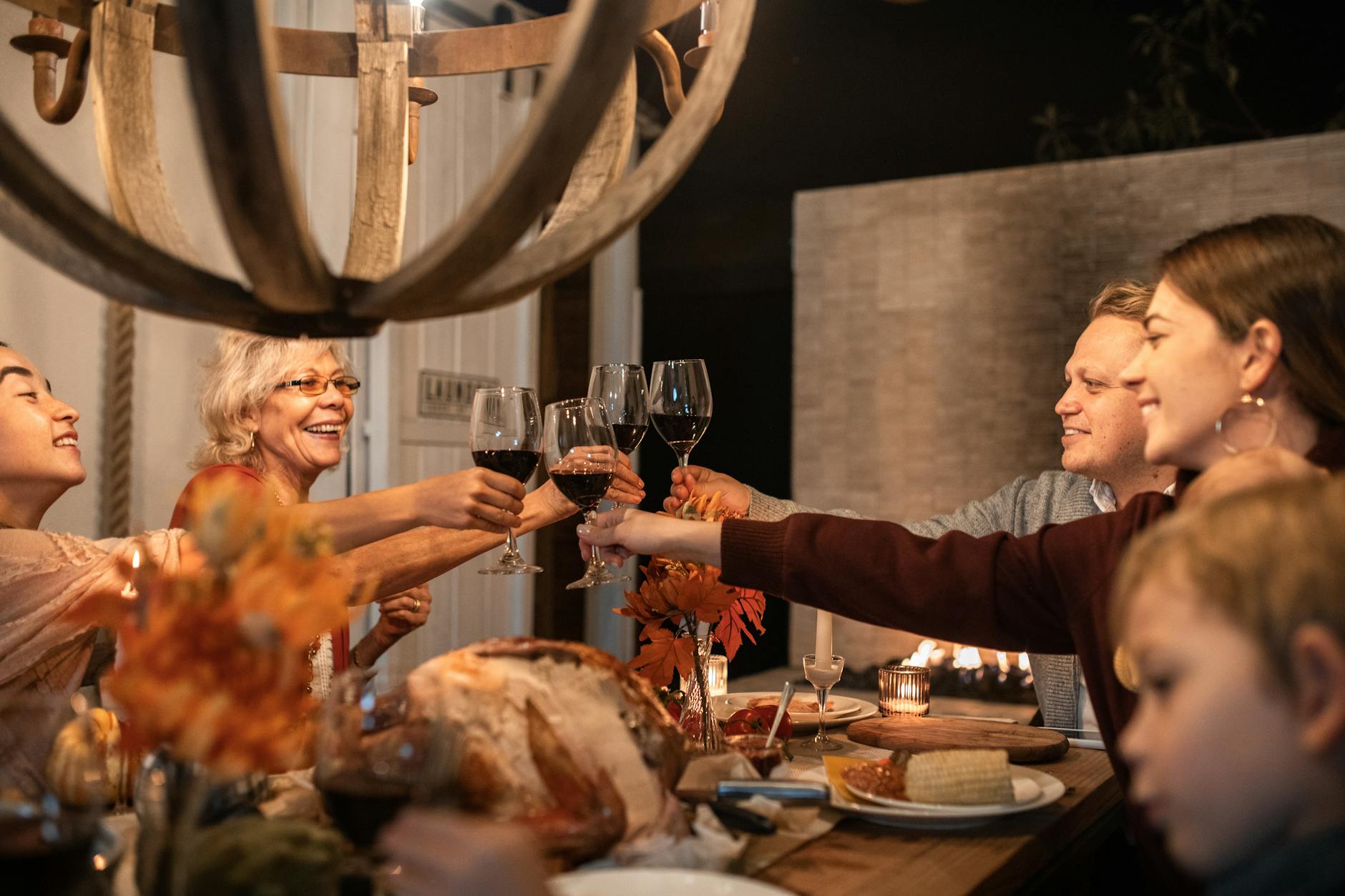 happy family toasting wine glasses