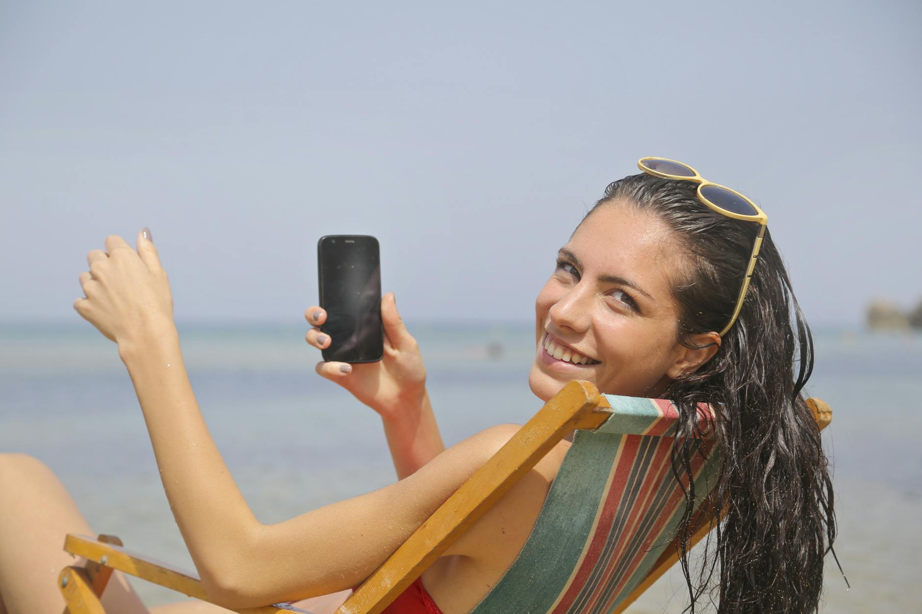 woman sitting on sun lounger