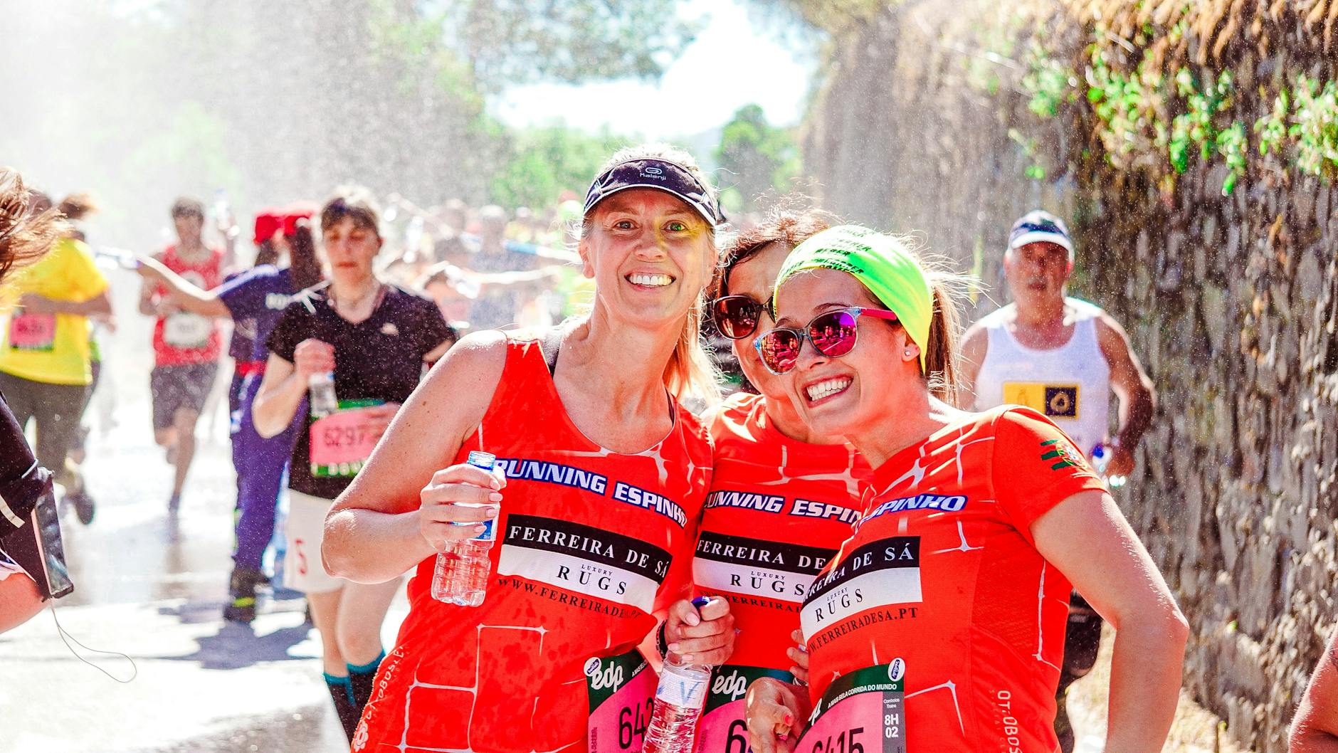 three female runners having group picture