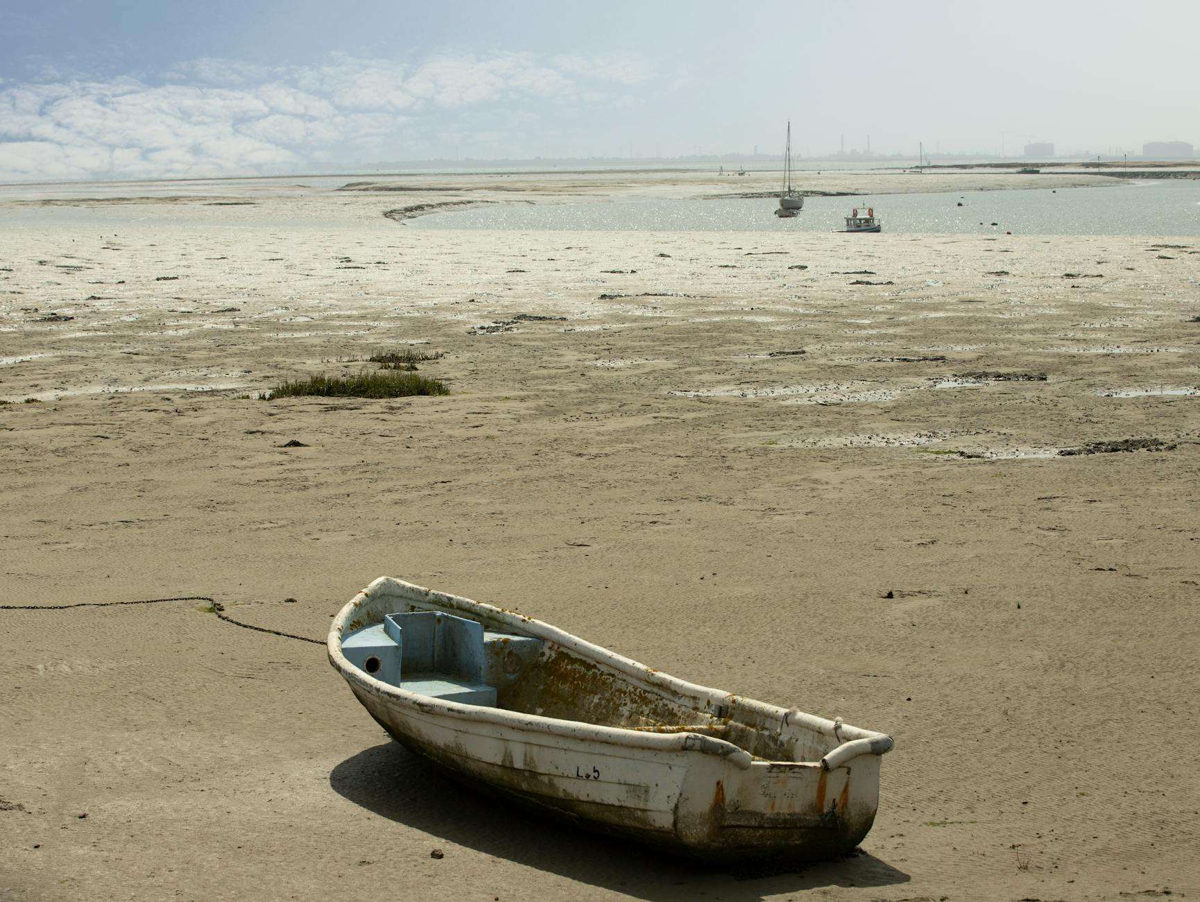 abandoned boat on shore