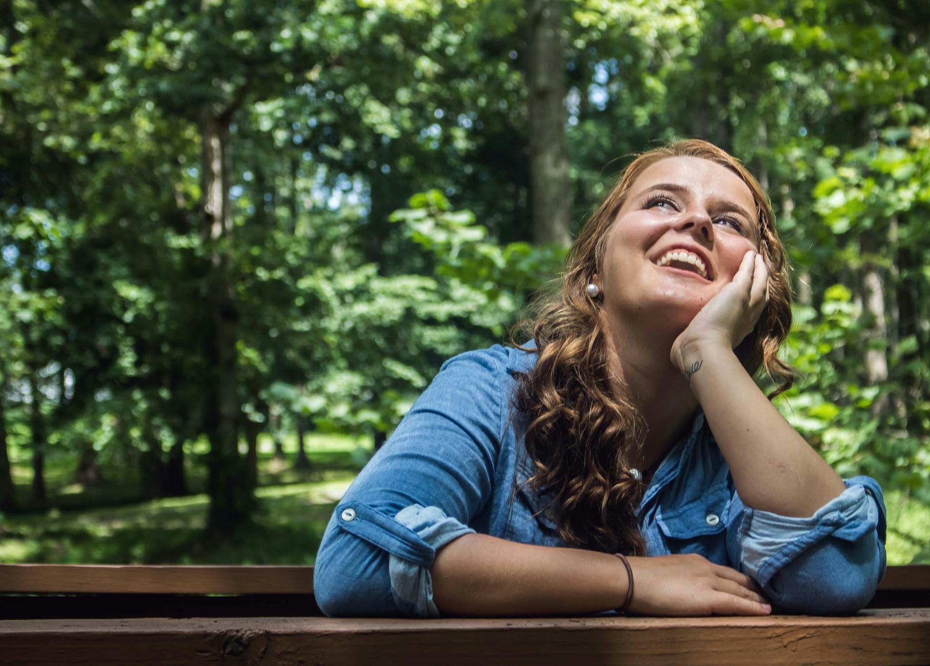 woman looking up smiling