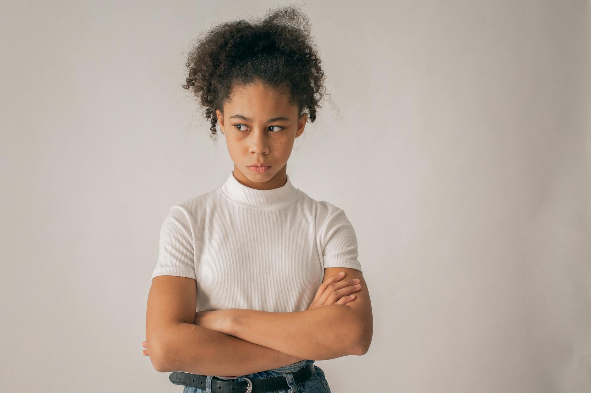 anxious black girl with crossed arms