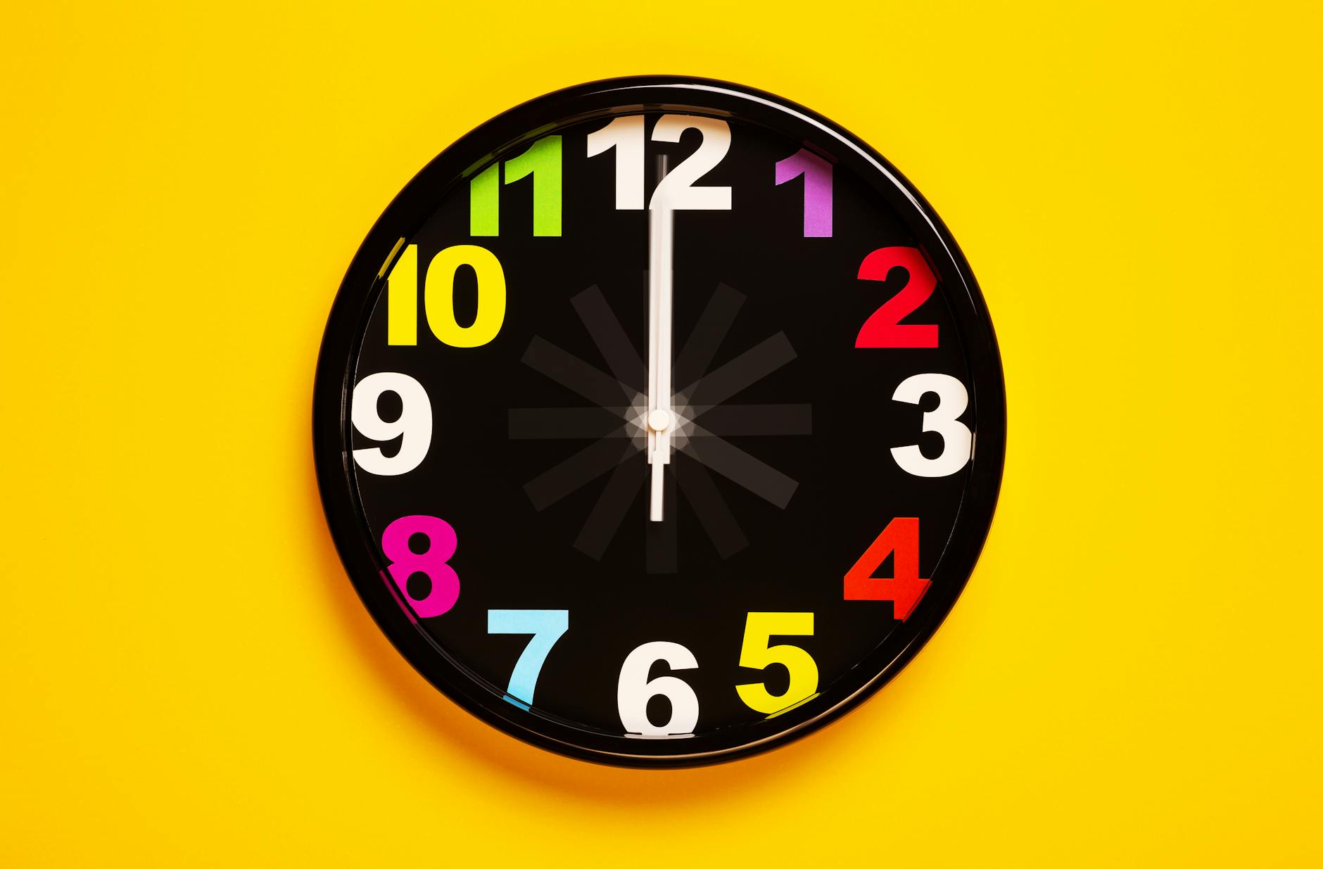 black and yellow analog clock