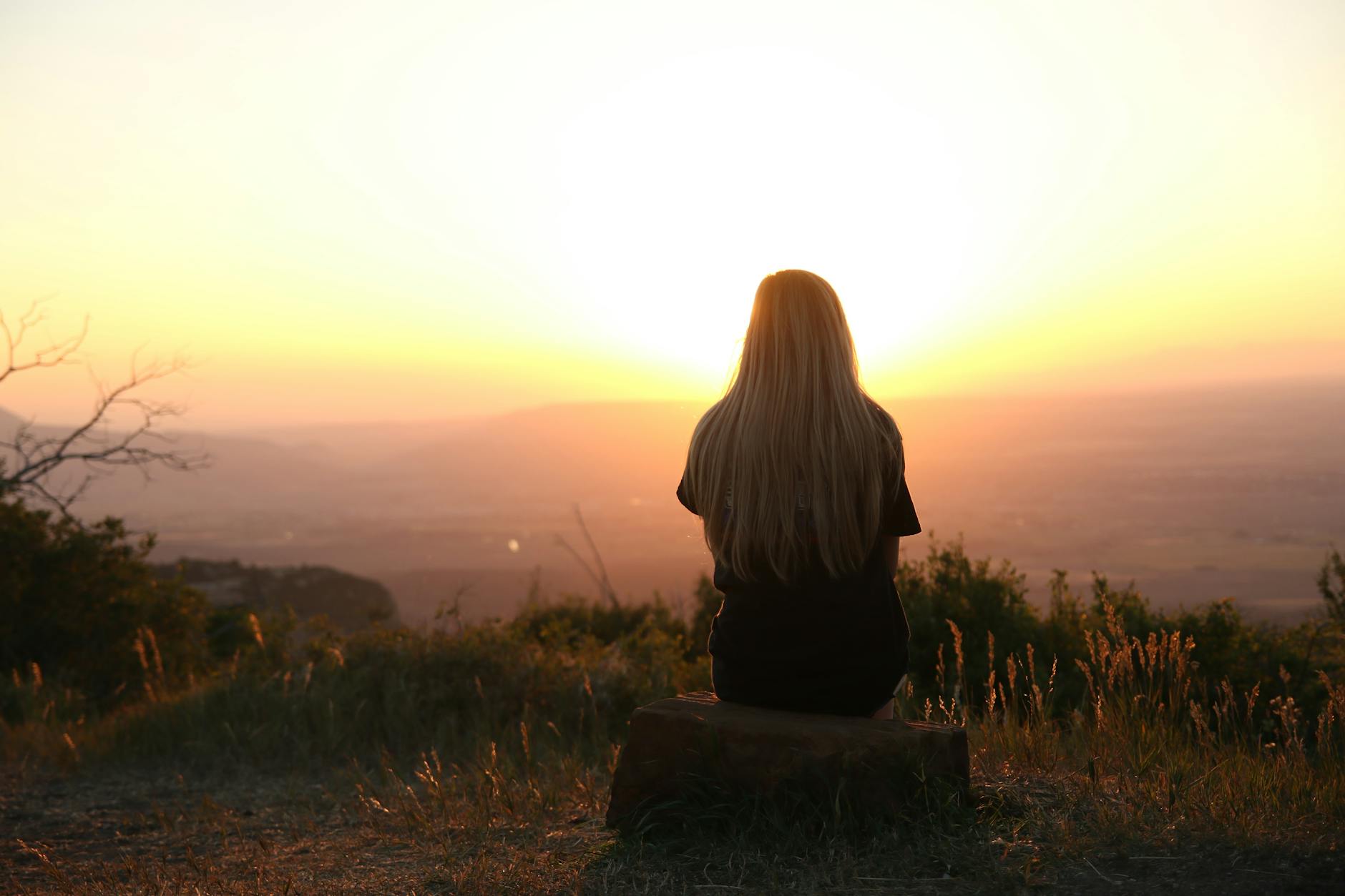 woman looking at sunset