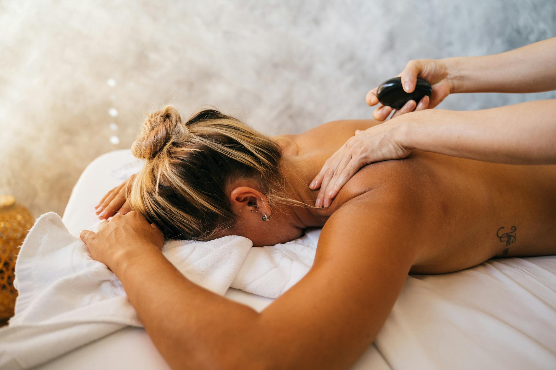 a woman having a stone massage