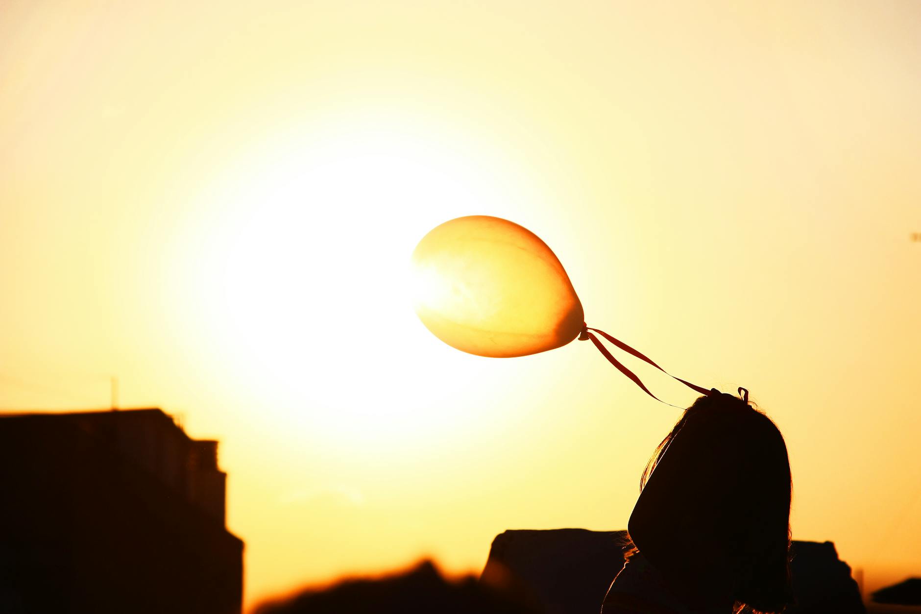 macro photography of balloon tied on hair