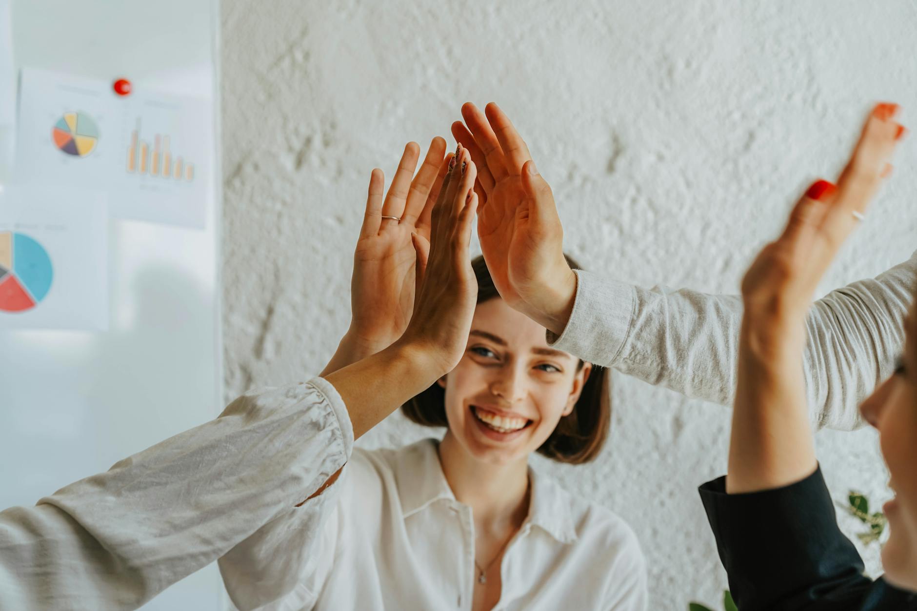 group of people doing high five