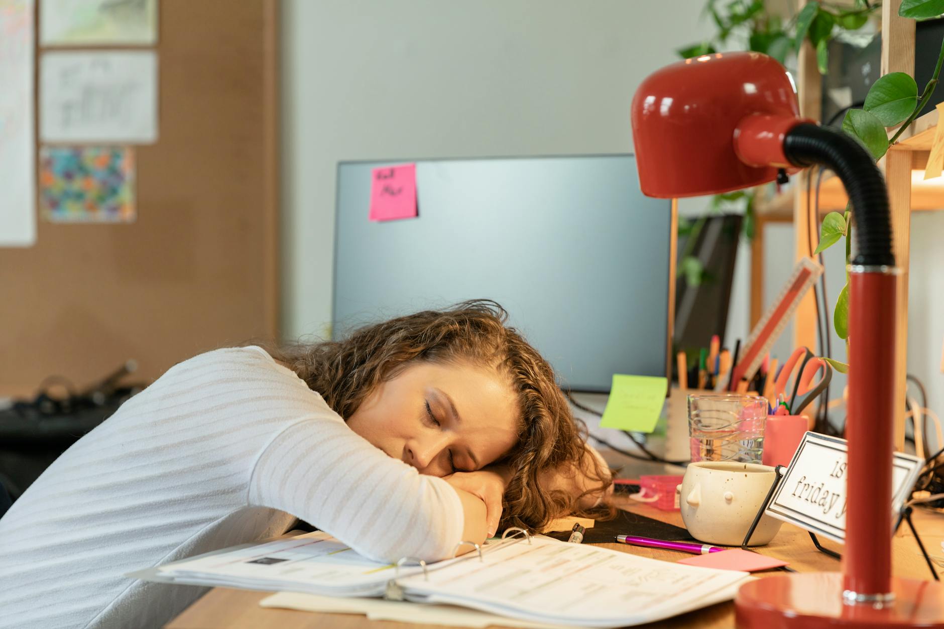 woman sleeping on her desk
