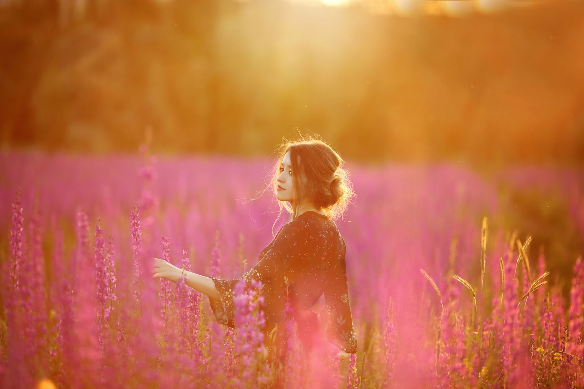 woman standing on a flower field