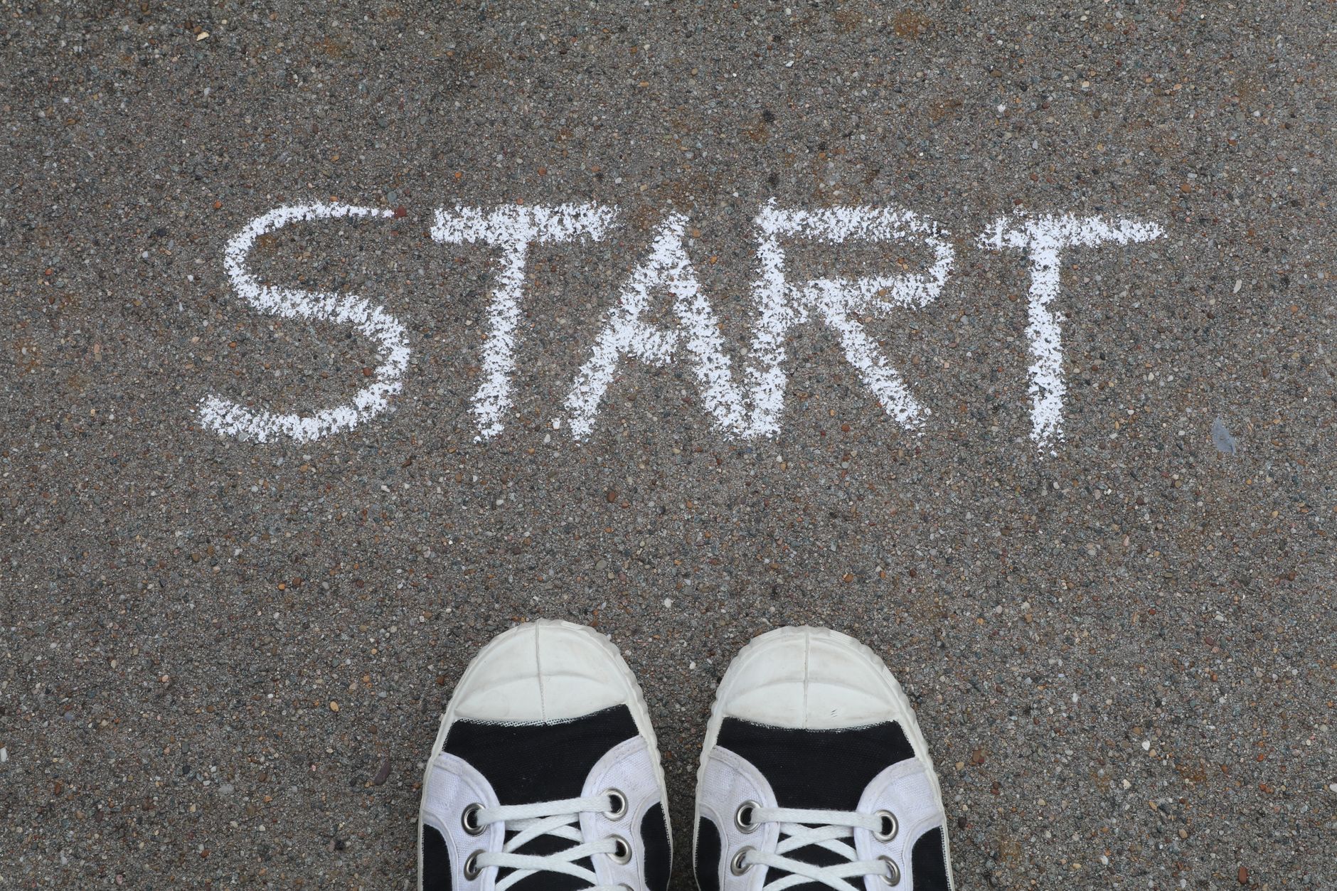 start written on asphalt